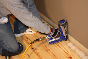 The expansion gap around the perimeter of the flooring can later be concealed with base moulding.