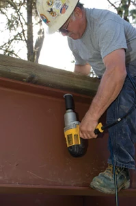 Mike used an electric impact driver to torque the nuts onto the stringer bolts.