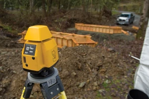 A laser level is the primary tool to transfer the elevations determined by the surveyor to the actual form elevations on the bridge site.
