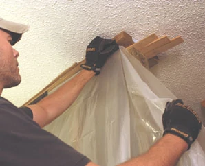 Use the brace wall as a frame to hang plastic sheeting as a dust barrier.