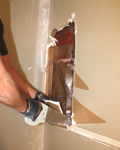 A drywall saw helps to remove the panels neatly, without smashing the gypsum board to dust and crumbles.