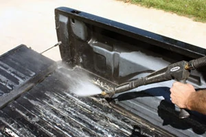 Pressure washing is a quick and powerful method to clean away the dirt and grime from the truck bed.