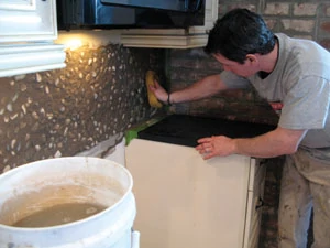 The key to wiping down grout effectively is to rinse the grout sponge often.
