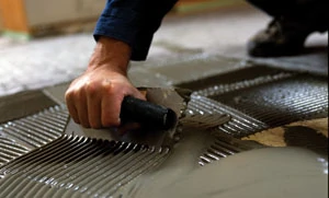 Use a 1/4" x 1/4" trowel to lay the thin-set for the solid mats.