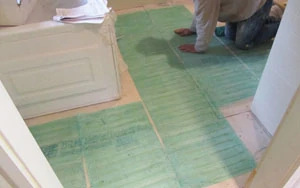 Wire-embedded mats are narrow and can be cut to fit around obstructions in small rooms. 