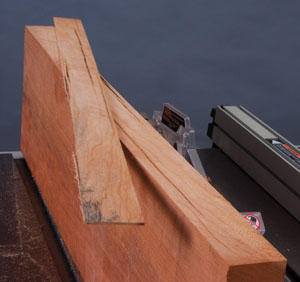 Hybrid table saws are suited for the serious home woodworker who values accuracy, stability and reliability. Shown here, this clean cut in cherry means no burning from stalls or a blade running at too high a speed—the fine work of a quality hybrid saw.