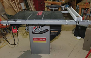 Shown is a Craftsman hybrid saw with a large granite table top, suited for a wide range of large woodworking projects.