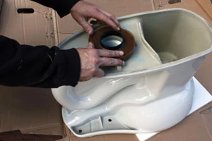 The toilet installation was a straightforward pull-and-replace procedure, beginning with the all-important wax ring.