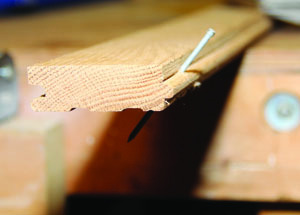 Nail through the face of the board