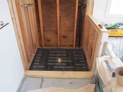 Prior to installing the shower pan I cover the subfloor with Ice and Water Shield to protect the copper from the wood. I also wrap 4 to 6” up the walls to protect the pan sides. 