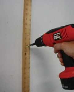 Traditional pressboard pegboards must be mounted with wood strips to provide the necessary standoff to hang tool hooks. Here we’re removing the old strips to upgrade to a new pegboard that requires no strips.