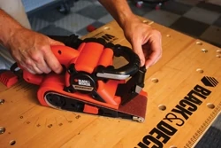 The Black & Decker Dragster belt sander has a low-profile nose and retractable guard that allow sanding in small spaces.