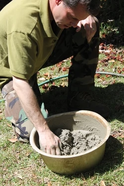 We mixed up small amounts of Sakrete masonry mortar in an old wash pan. 