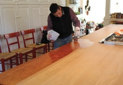 We applied the finish to the wood in 4x4’ areas using a high-quality brush. 