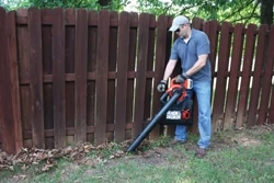 Remove accumulated organic matter from outdoor wood where the debris can contribute to moisture problems and rot. Shown is the Black & Decker LSWV36 Mulching Blower/Vac. 