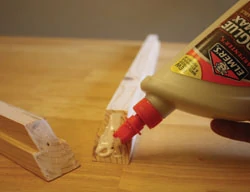 Apply glue to the corners and clean up any excess that squeezes from the joint. 