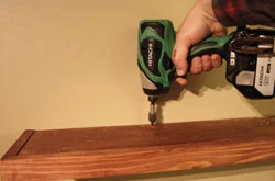 Fasten the shelf to the cleat with wood screws.