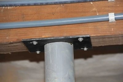The top plate screws flush and securely to the beam.
