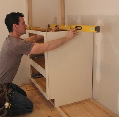 Again, layout, level and plumb are key—especially as you get started building the towers. Check the top of the cabinet to make sure it’s level.