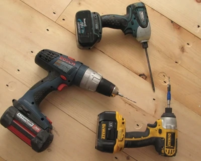 An impact driver does the pre-drill/countersink. A cordless drill-driver drills the rest of the pilot hole. Another impact drive sends the trim-drive screws home.