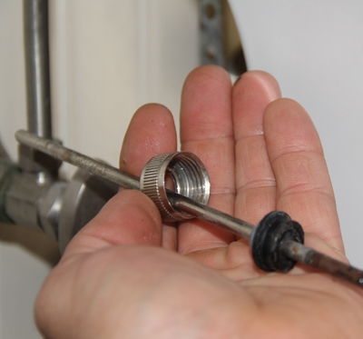 Unscrew the nut that holds the pivot arm so it can be removed from the sink’s tail-piece. You can then lift the drain plug out of the sink. 