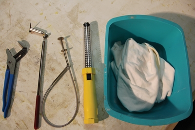 The tools shown can help you retrieve lost items from a drain pipe.
