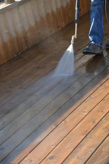 If you are power washing, always use as low a pressure as possible—between 500 to 600 psi. As a rule of thumb, try to never get closer than 12" to the wood deck.