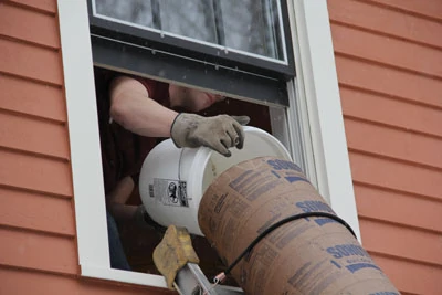 Second-story remodels can utilize a garbage chute at the bathroom window.