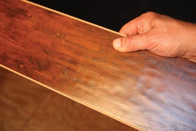 The Kensington Manor laminate flooring from Lumber Liquidators features the beautiful look and texture of hand-scraped wood.