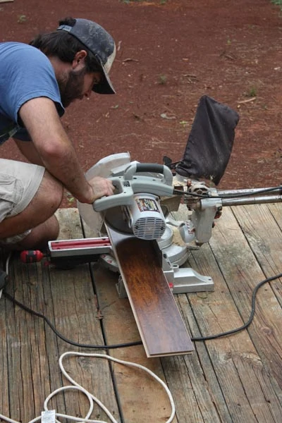 Laminate is easy to cut with a handheld circ saw, miter saw or even a hand saw. However, a table saw is the best tool for ripping boards to width.