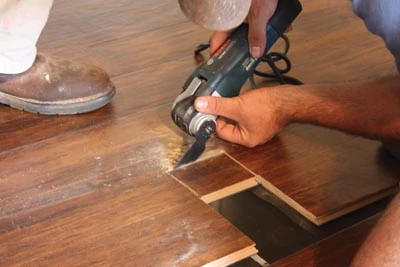 An oscillating multi-tool is a handy gadget for notching out floor registers and under-cutting door jambs.