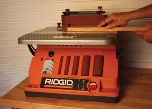 The Ridgid EB4424 works as an oscillating belt sander and features on-tool accessory storage.