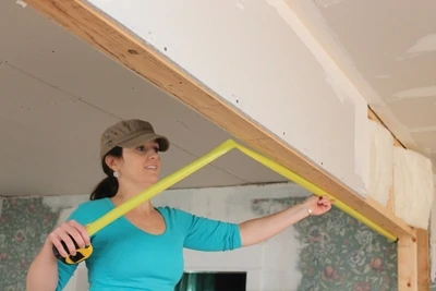 Even though pocket door hardware is adjustable after the doors are hung, if you’re framing the walls yourself, it’s best to layout the rough opening carefully and make sure the head jamb is as level as possible. If the floor isn’t level, as is often the case in old houses or in basement remodels, lay out from the high spot and make sure to keep at least 3/4" clearance under the door when it’s installed.