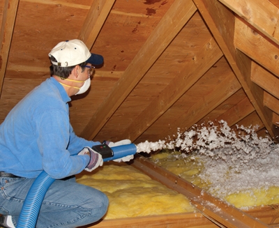 Some types of insulation can be blown into the attic using a machine that many home centers offer free of charge. (Photo Courtesy Certainteed)