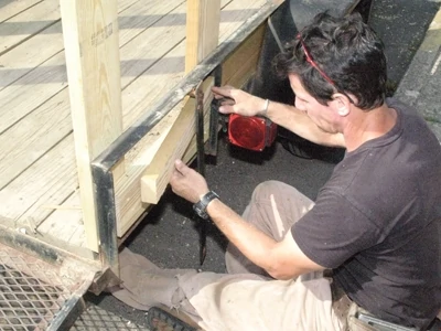 Add blocking as needed to create a wall around the trailer’s angle iron projections. 