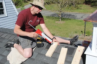 Predrill holes in the 2x4 mounting blocks and apply silicone to the bottom of the prior to attaching them to your roofing. 