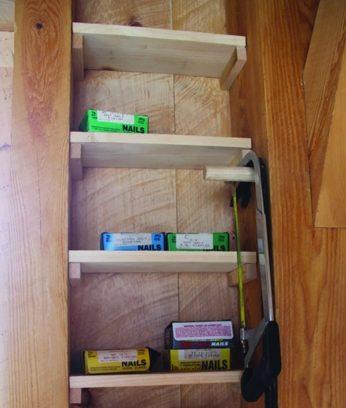Shelves don’t have to be fancy. Simple wooden platforms can store items off the floor and easily visible. 