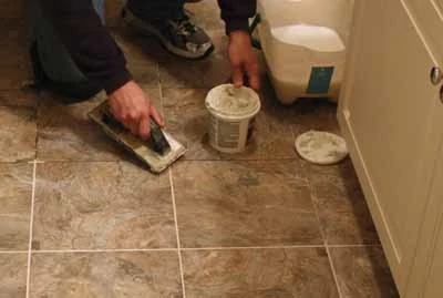 Apply the grout with a rubber float. 