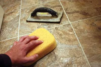 Use a sponge and plenty of clean water to clean up excess grout as your work. 