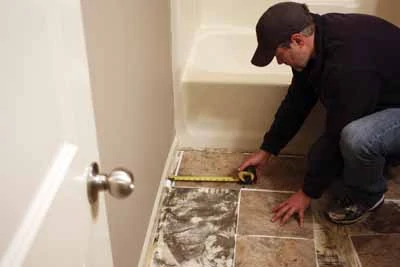 Lay out a dry run to determine tile placement. Avoid “silver” tiles against the walls and watch out for repeating patterns.