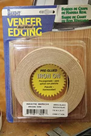 Veneer tape, also called edge banding, is available at woodworking stores and comes with heat-activated adhesive backing. 