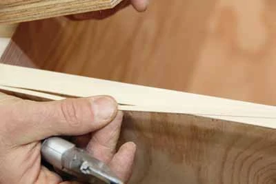 A sharp utility knife will make a clean cut through the tape. 