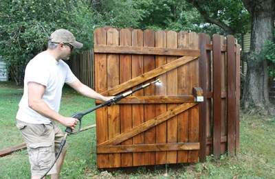 First step is to pressure-wash the fence to rejuvenate the wood. 