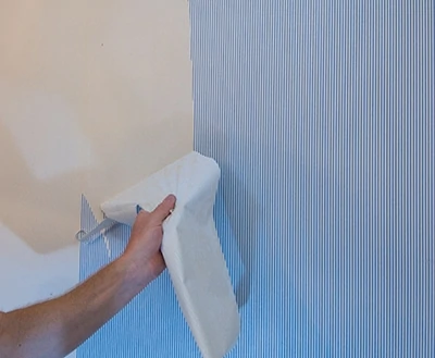 Some vinyl wallpapers can be removed by first peeling off the top vinyl layer.