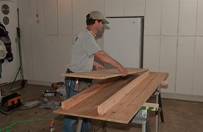 Place the main table surface on the 2x4 runners. 