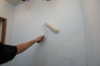 It's important to apply primer over the finished skim coat before painting with the top coat. Primers fill tiny voids in the drywall compound for proper sealing and adhesion. 
