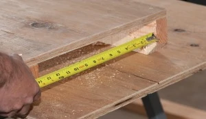 Measure the space between the two table supports and cut wing boards that will fit underneath with about ½” of room. 