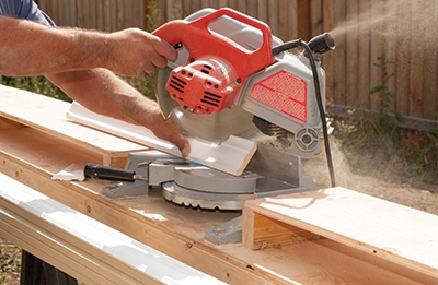 Notice how the table provides a surface under the wing boards for small trim pieces. Plus, the same saw horses that hold the saw table also support material waiting to be cut. 