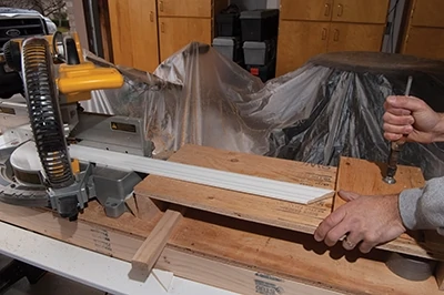 The wing boards also provide an excellent surface to clamp a stop for making multiple cuts of the same length. 