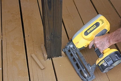 Trim boards are then installed using a cordless finish nailer and stainless steel finish nails. 